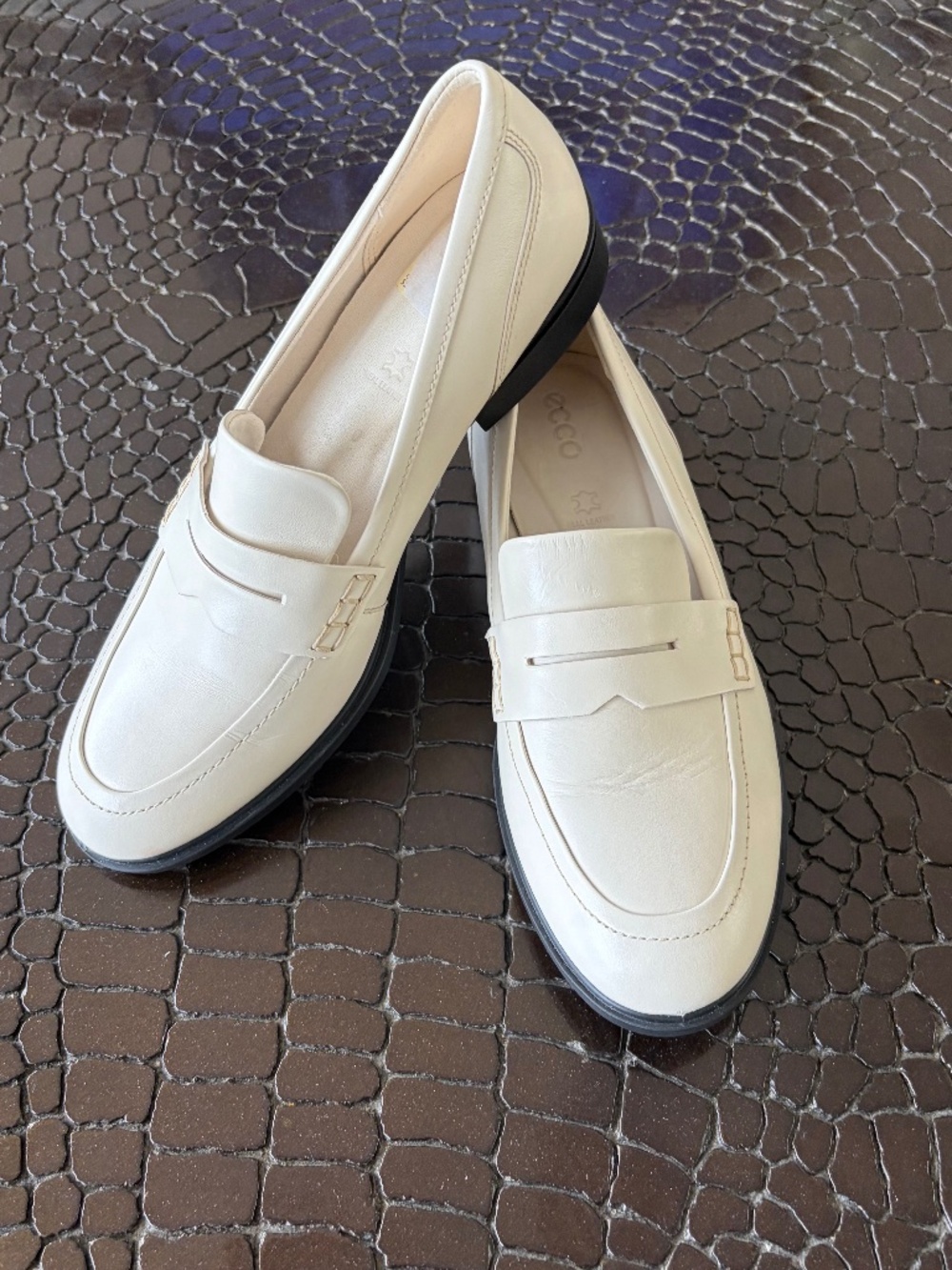 Ecco creamy white, leather penny loafers.